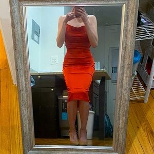 Satin below the knee dress with an open back